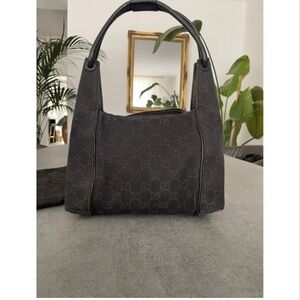 Gucci Hobo bag in brown GG monogram denim fabric.